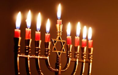 Candles lit for the eighth night of Hanukkah